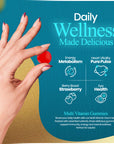 hand holding gummy with slogan saying daily wellness made delicious.